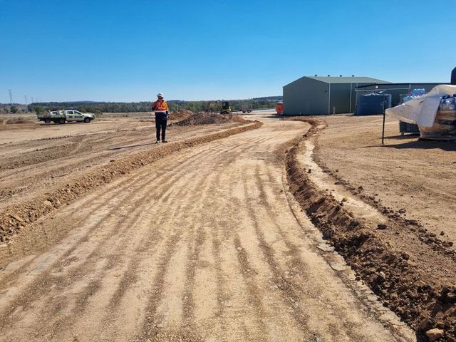 Newly formed rural access road with site supervisor