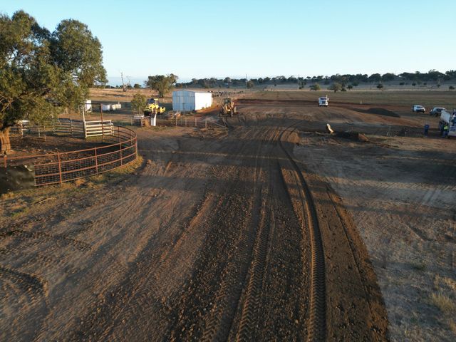Aerial view of an earthworks site with formed roads and cattle yards