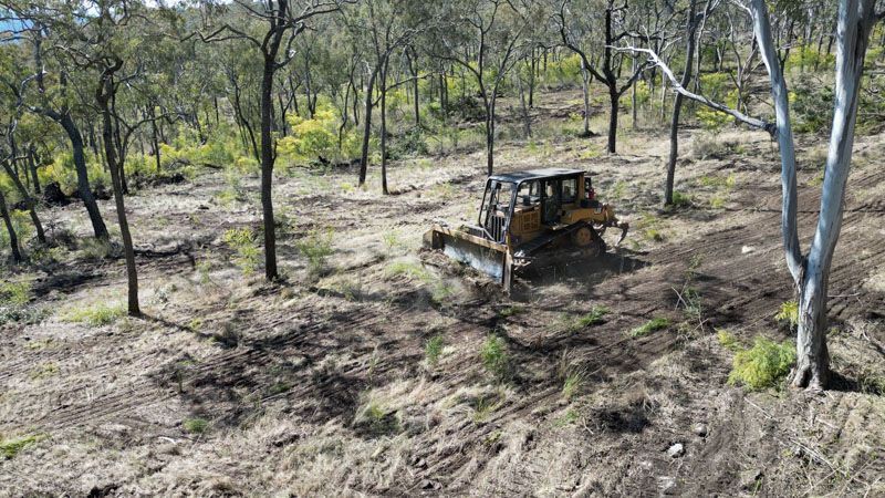 Bulldozer clearing scrub on a Darling Downs rural property
